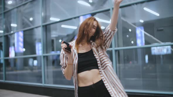 Young Attractive Redhead Hipster Woman Dance on Street at Night