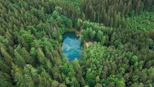 Aerial View of Blue Colored Forest Lake in Poland
