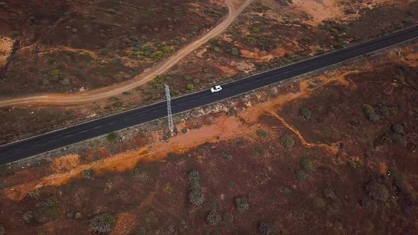 Top View of a Car Rides Along a Desert Road on Tenerife Canary Islands Spain