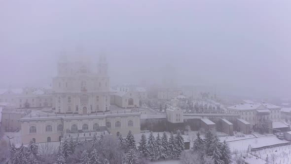 The Pochaev Lavra in the Fog at the Winter Aerial View