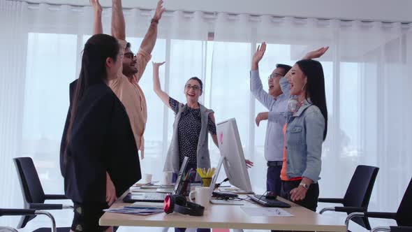 Successful Business People Celebrating Project Success at Office