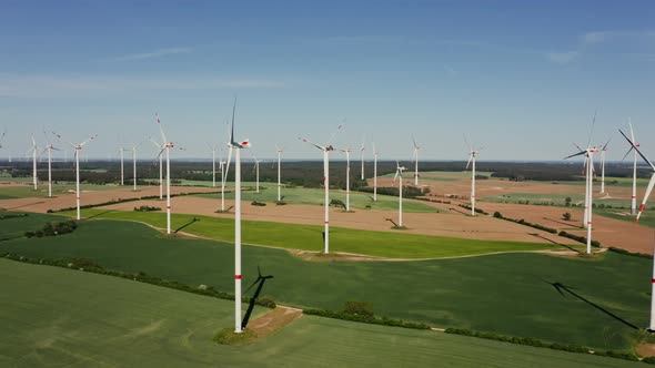 A Drone Shot of a Massive Wind Farm in Agricultural Land