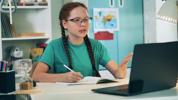 Teenage Girl Studying During an Online Class