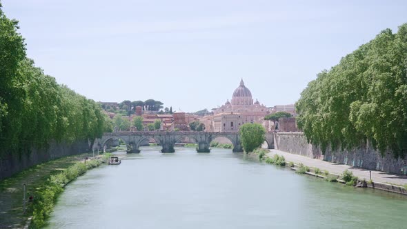 Green Trees Along Embankment Near Saint Angelo River Bridge