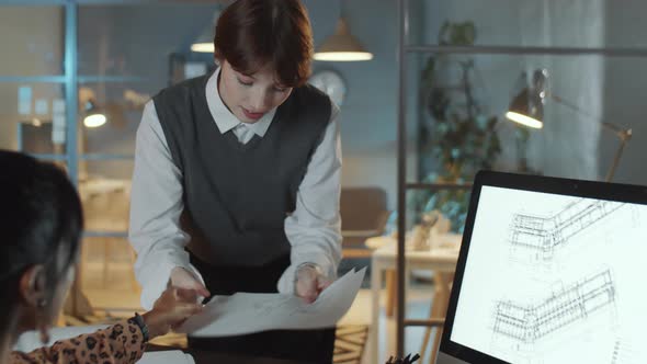 Female Architects Working in Night Office