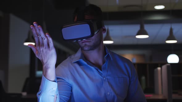 Businessman using VR helmet in a modern office