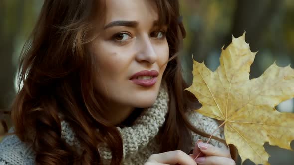 Beautiful Female Dreaming in the Autumn Park