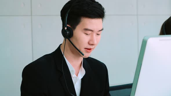 Business People Wearing Headset Working in Office