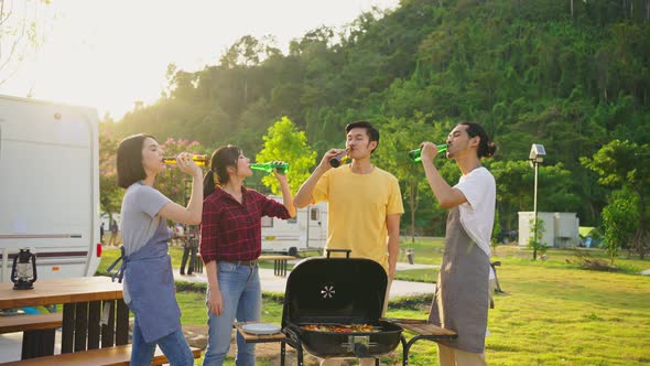 Group of Asian man and woman are having new year party outdoor in the evening together.