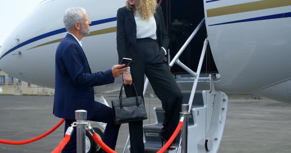 Business People Interacting with Each Other at The Entrance of Private Jet