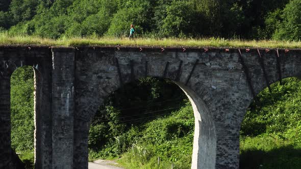Hiker Girl Crossing The Old Stone Bridge 8