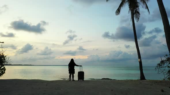 Tourist posing on perfect coastline beach lifestyle by transparent water and bright sand background 