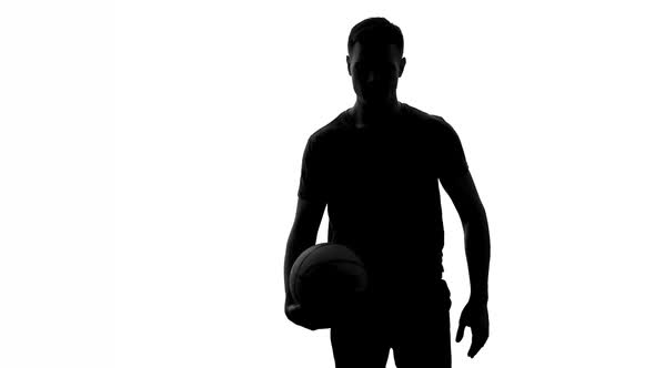 Man Bouncing Ball and Passing It to Another Player, Basketball Training, Shadow
