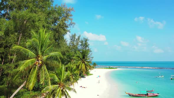 Aerial view panorama of marine coast beach vacation by turquoise ocean and white sandy background of