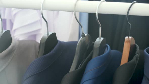 Business Shirt and Suits on a Hanger in a Store