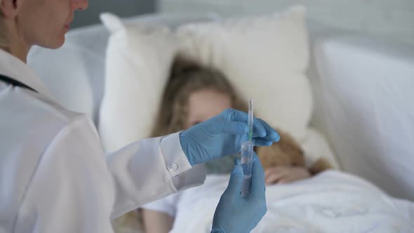 Girl Looking at Syringe in Doctors Hand With Scared Face, Medical Treatment