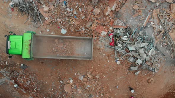 Aerial Overhead View of a Demolition Site with Excavator and Truck