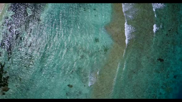 Aerial panorama of exotic resort beach adventure by blue sea and white sandy background of a dayout 