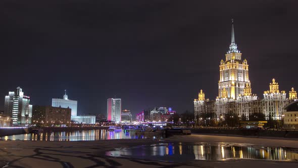 Hotel Ukraine Winter Night Timelapse. Seen As Reflected in the Moscow River.