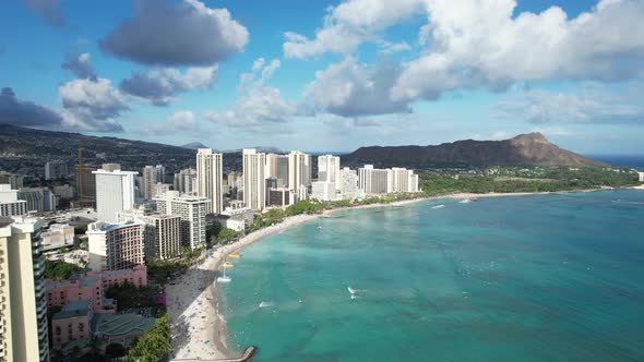 Beautiful 4k aerial drone shot gliding past luxury beach front hotels on this tropical island vacati