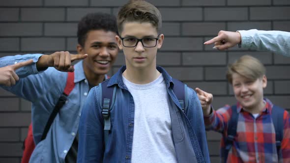 Boy Boldly Looking Into Camera Despite Mockery of Classmates, Resisting Bullying