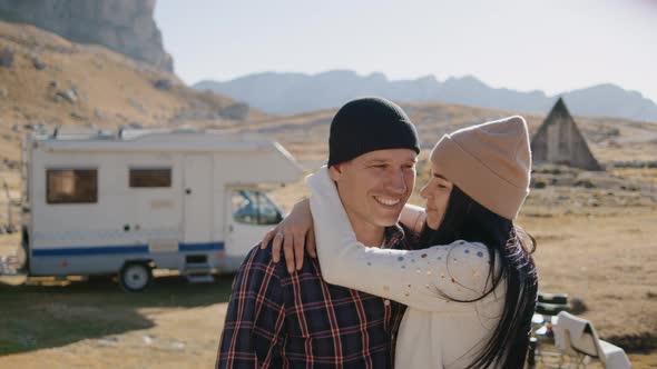 Loving Couple Stands at Rv in Camp Background of Mountains in Autumn Rbbro