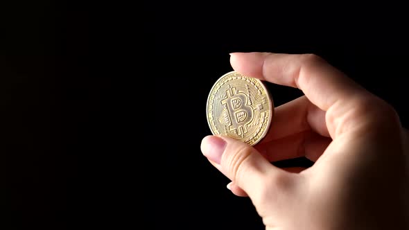 Woman Hand Holding Bitcoin Coin