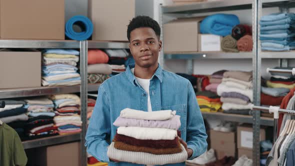 Portrait View of the Multiracial Male Worker Looking at the Camera and Stretching to the Camera