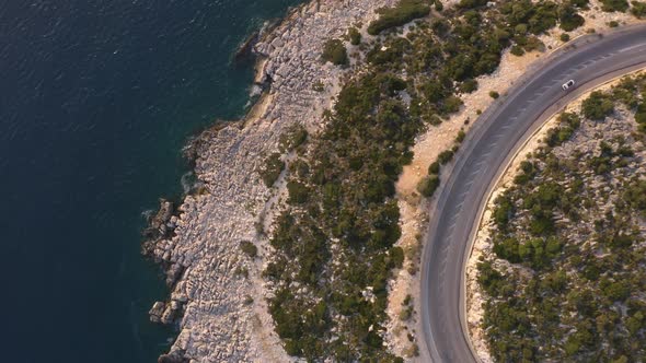 Aerial View of Mountain Road Above the Sea Coast