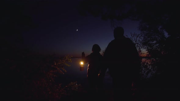 A Man and a Woman By the River