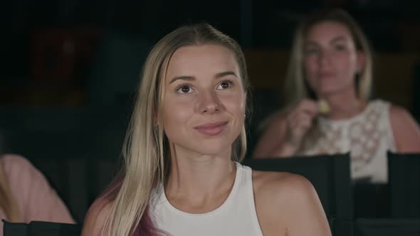 Young Woman Watch Film in the Cinema