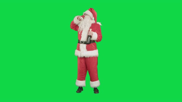 Santa Wishing Merry Christmas and Drinking Champagne on a Green Screen Chrome Key
