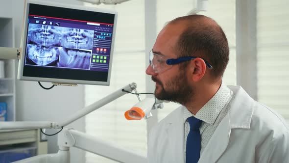 Portrait of Stomatologist Telling the Treatment To Woman