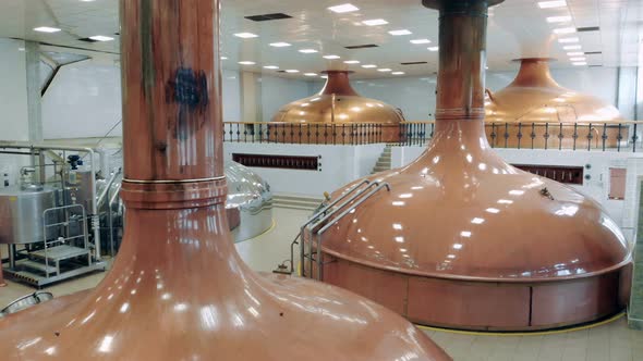 Beer Brewed in Metal Tanks in a Facility at a Factory