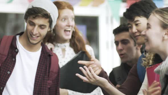 Cheerful college students talking