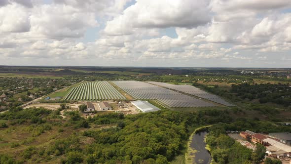 Aerial view of the Solar panels on a hill above the river