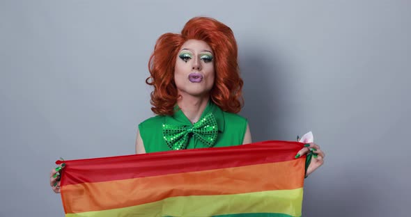 Happy drag queen holding rainbow flag - Lgbtq concept