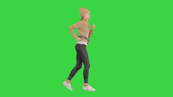 Female Runner Training Jogging Outdoors on a Green Screen Chroma Key