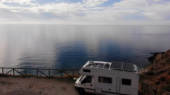 Camper Solar Panels on Roof Camping on Sea Cliff. Aerial View