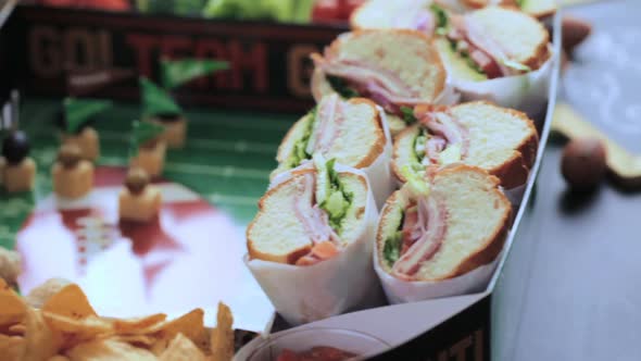 Football Snack Stadium filled with sub sandwiches, veggies and chips.