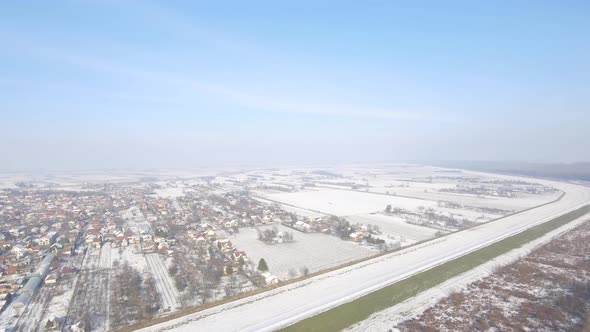 Aerial Shot Of A Village Landscape In Winter alt
