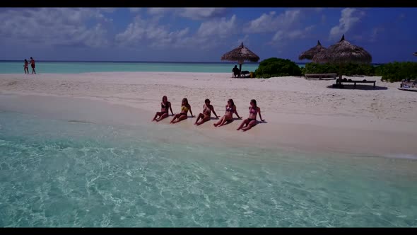 Girls relaxing on perfect sea view beach adventure by clear sea and white sand background of the Mal