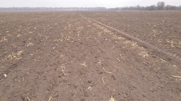 Empty Plowed Field in Autumn Aerial View