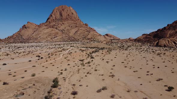 Aerial footage of a huge rocky mountain in Erongo region of Namibia