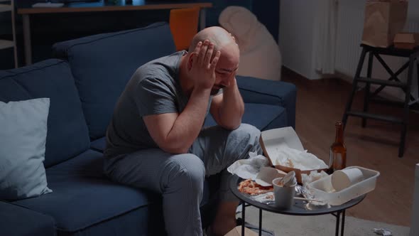 Stressed Lonely Man with Headache Feeling Vulnerable