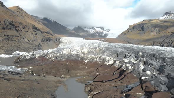 Aerial shot flying back from a large glacier.