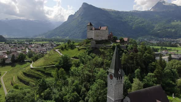 Aerial shot of St. Nikolaus church and Gutenberg Castle, Balzers, Liechtenstein