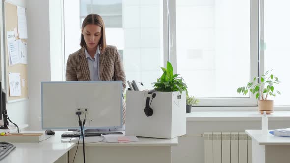 Woman Leaving Office to Work from Home