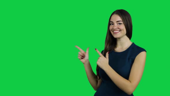 Happy excited girl pointing promoting in front of the green screen