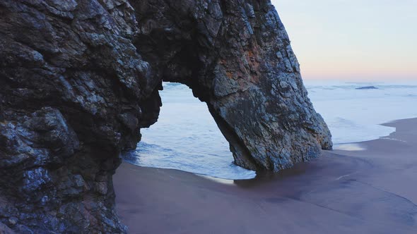 Aerial Drone View of Lisbon Beach with Arch Rock Formation, on the Portugal Coast by Sintra at Praia